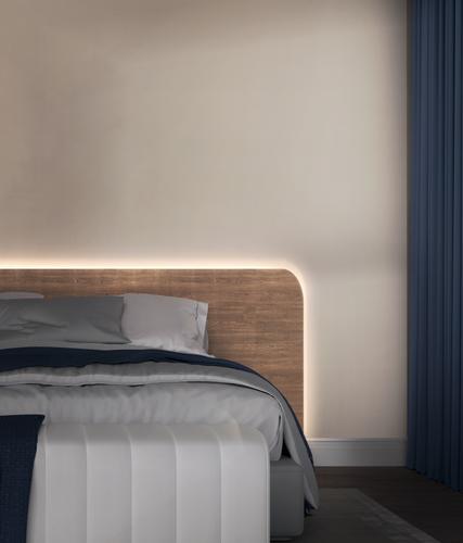 Bedroom dimly lit by Wyze Lightstrip from setting sleep routines in Wyze app